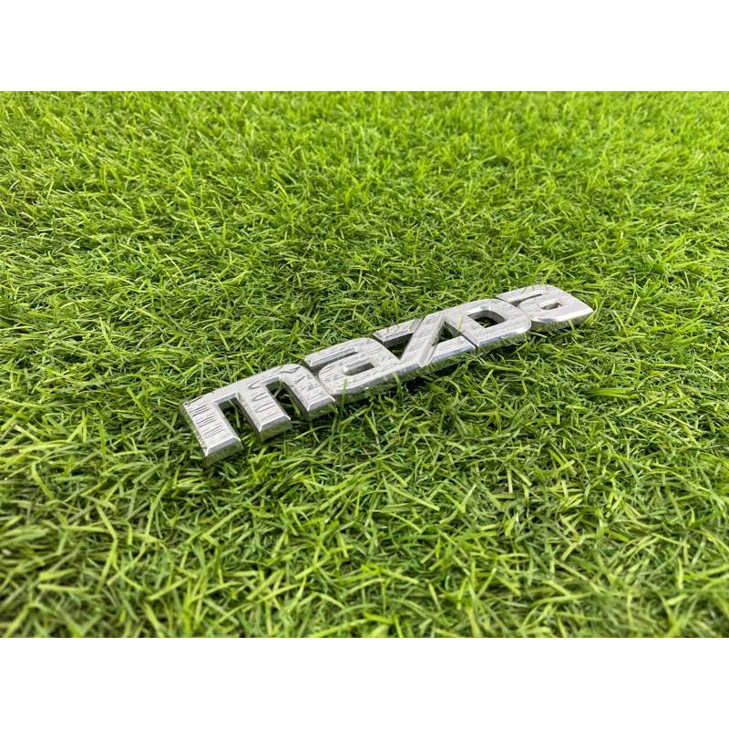 Эмблема (кузов и элементы) Mazda 6 GG 2004 2.0 RF5 GJ6A51711