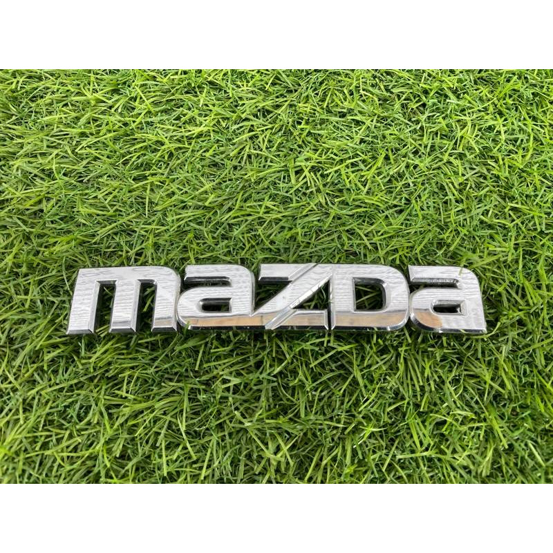 Эмблема (кузов и элементы) Mazda 6 GG 2004 2.0 RF5 GJ6A51711