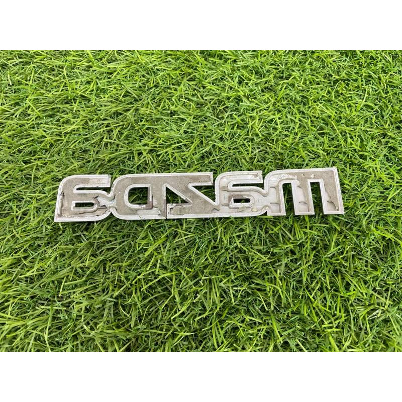 Эмблема (кузов и элементы) Mazda 6 GG 2004 2.0 RF5 GJ6A51711