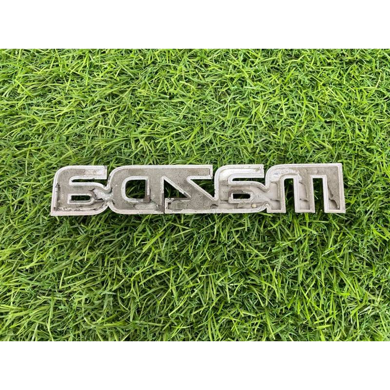 Эмблема (кузов и элементы) Mazda 6 GG 2004 2.0 RF5 GJ6A51711